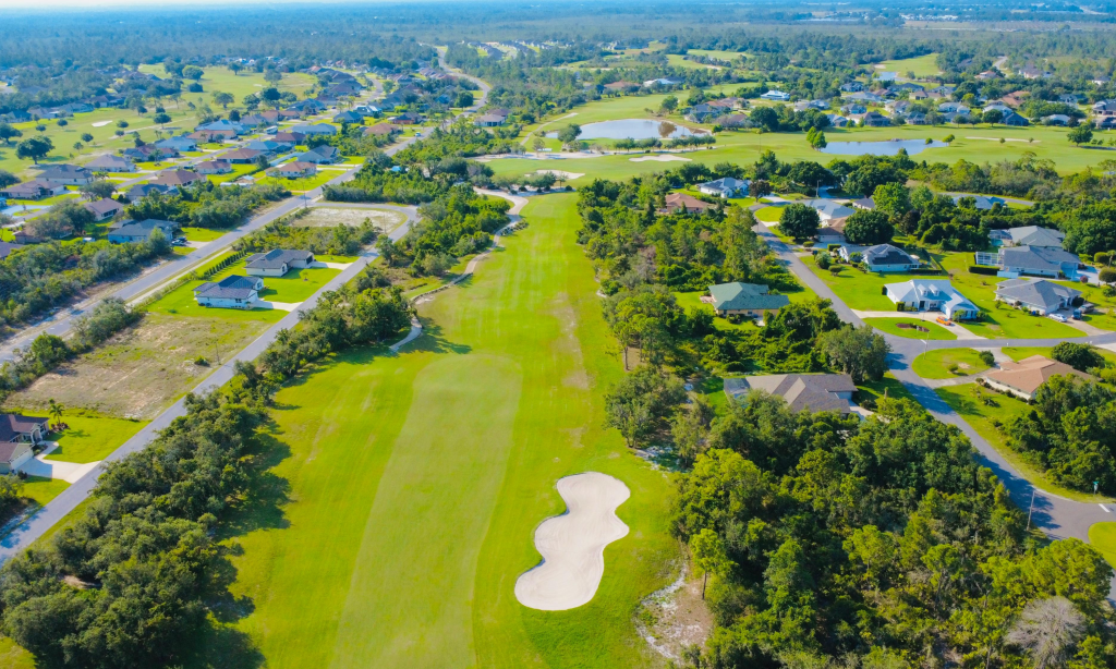 Aerial view of Pinehurst, NC golf course community with homes and green fairways